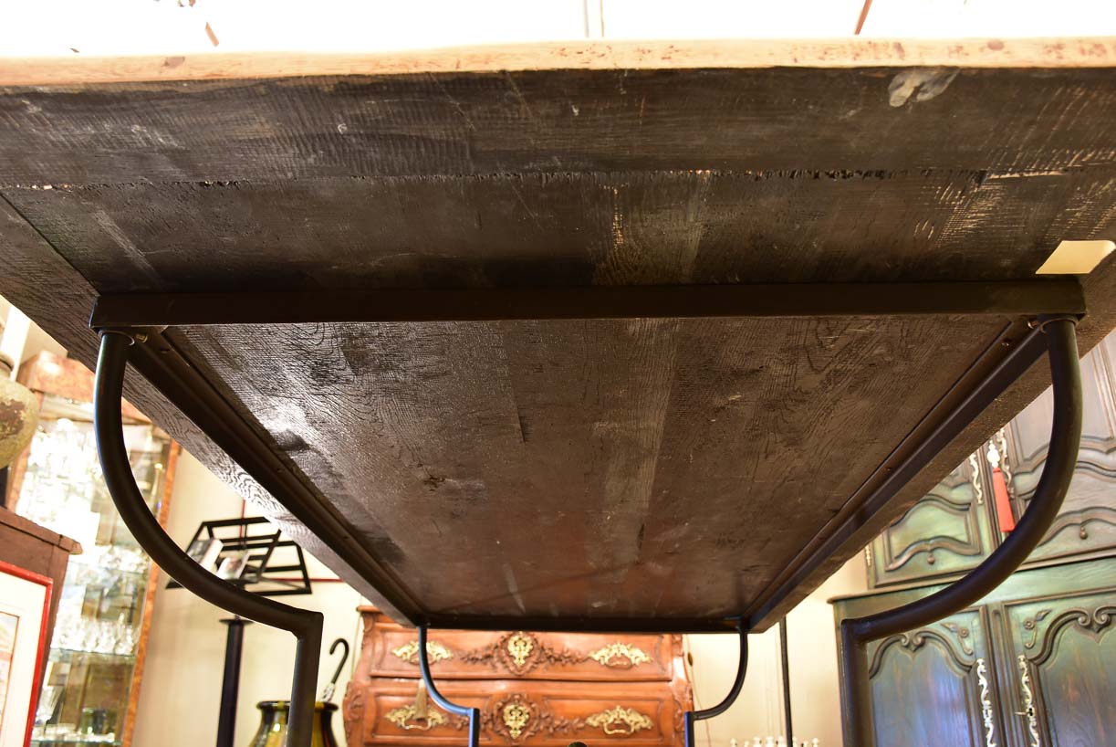 Antique French oak dining table with iron base