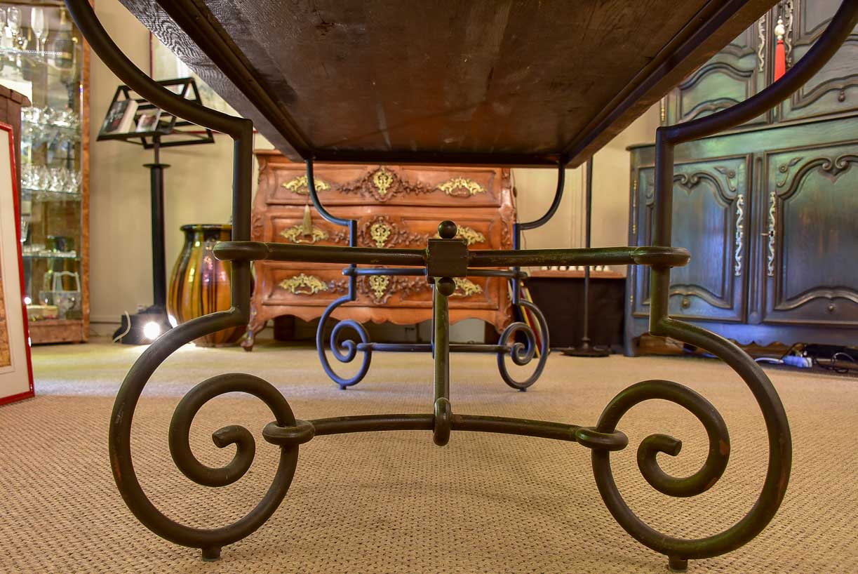 Antique French oak dining table with iron base