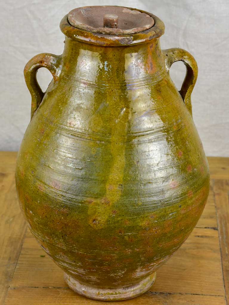 Antique terracotta pot with lid and green glaze