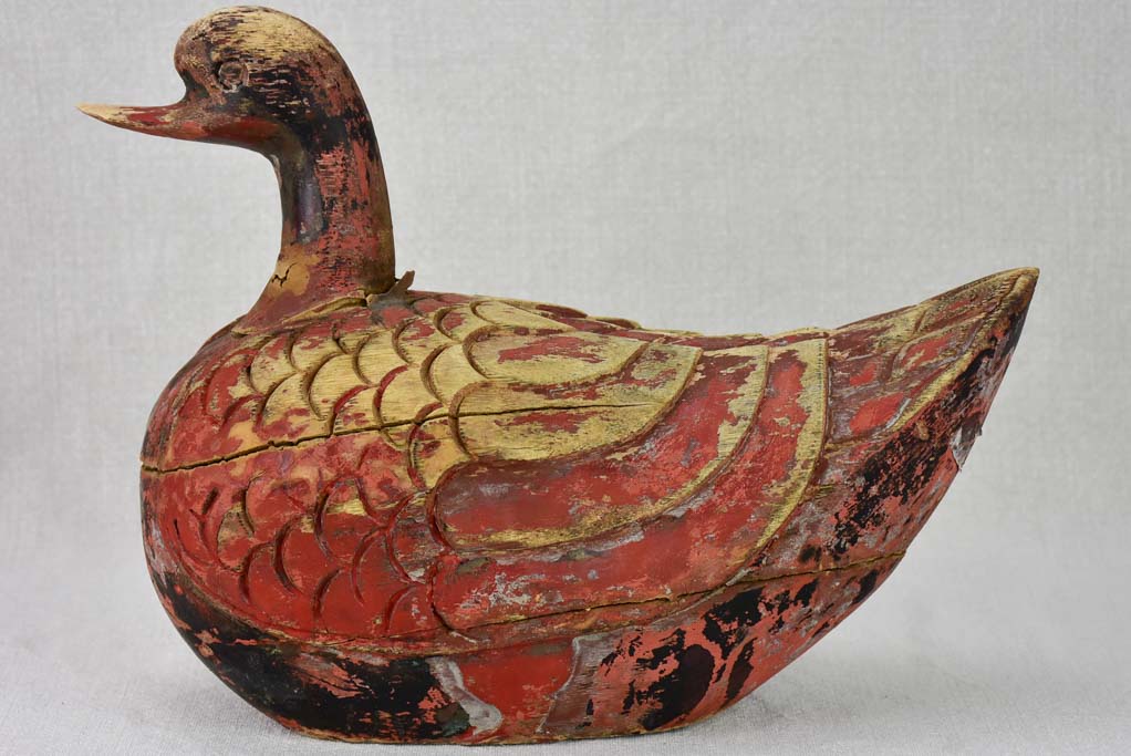 Antique French carved wooden sculpture of a duck with red patina - 1930's