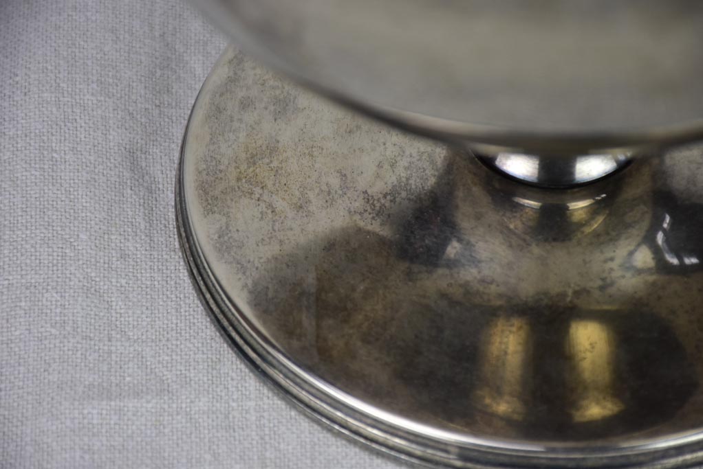 Silver-patterned heirloom rose-filled cup
