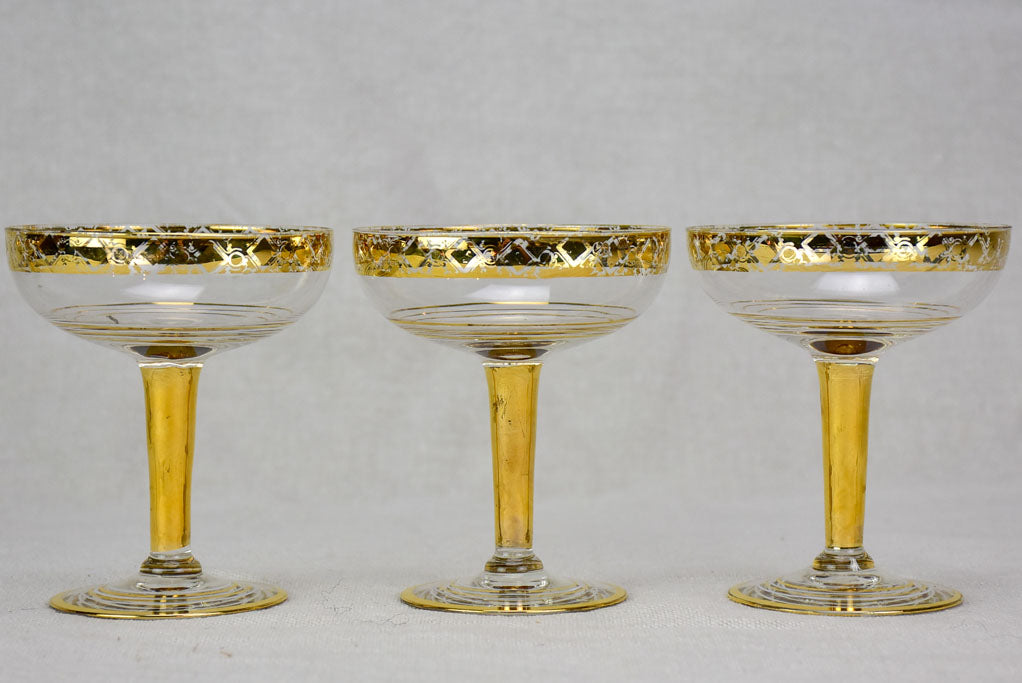 Six French champagne cups with gold decoration