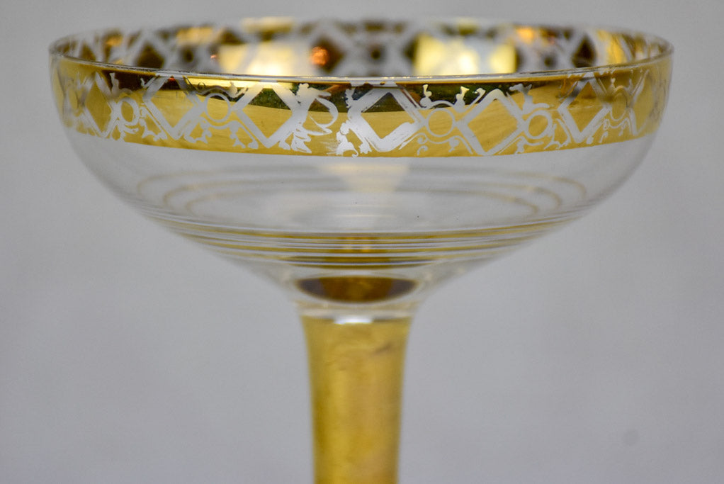 Six French champagne cups with gold decoration
