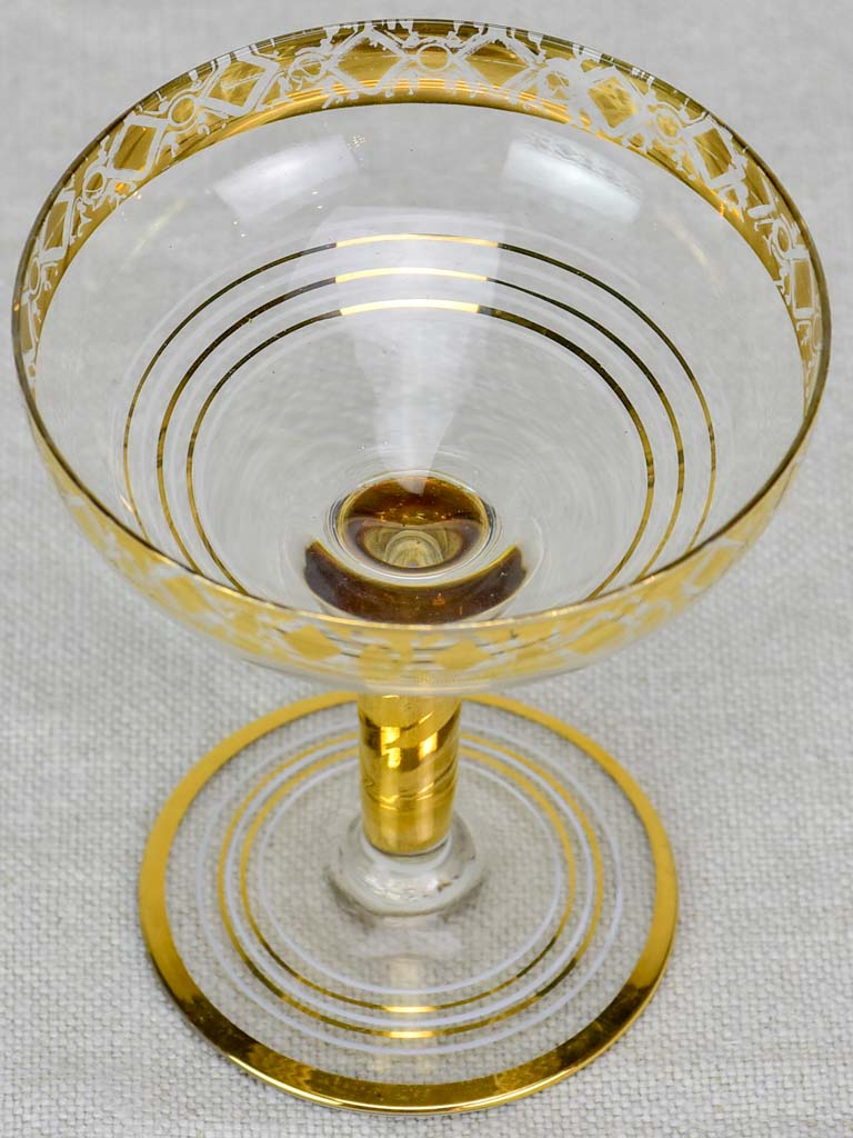 Six French champagne cups with gold decoration