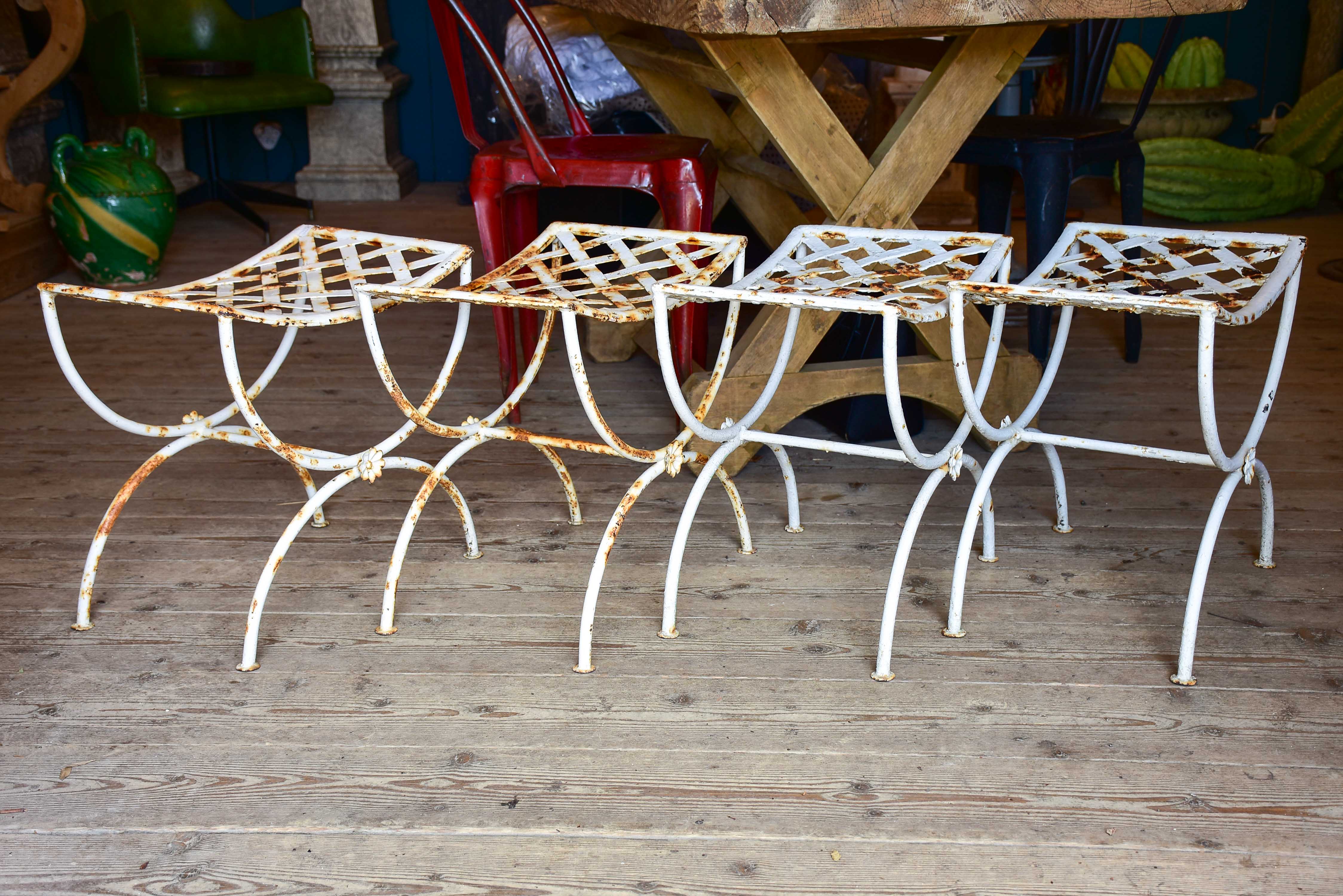 Four vintage French iron garden stools