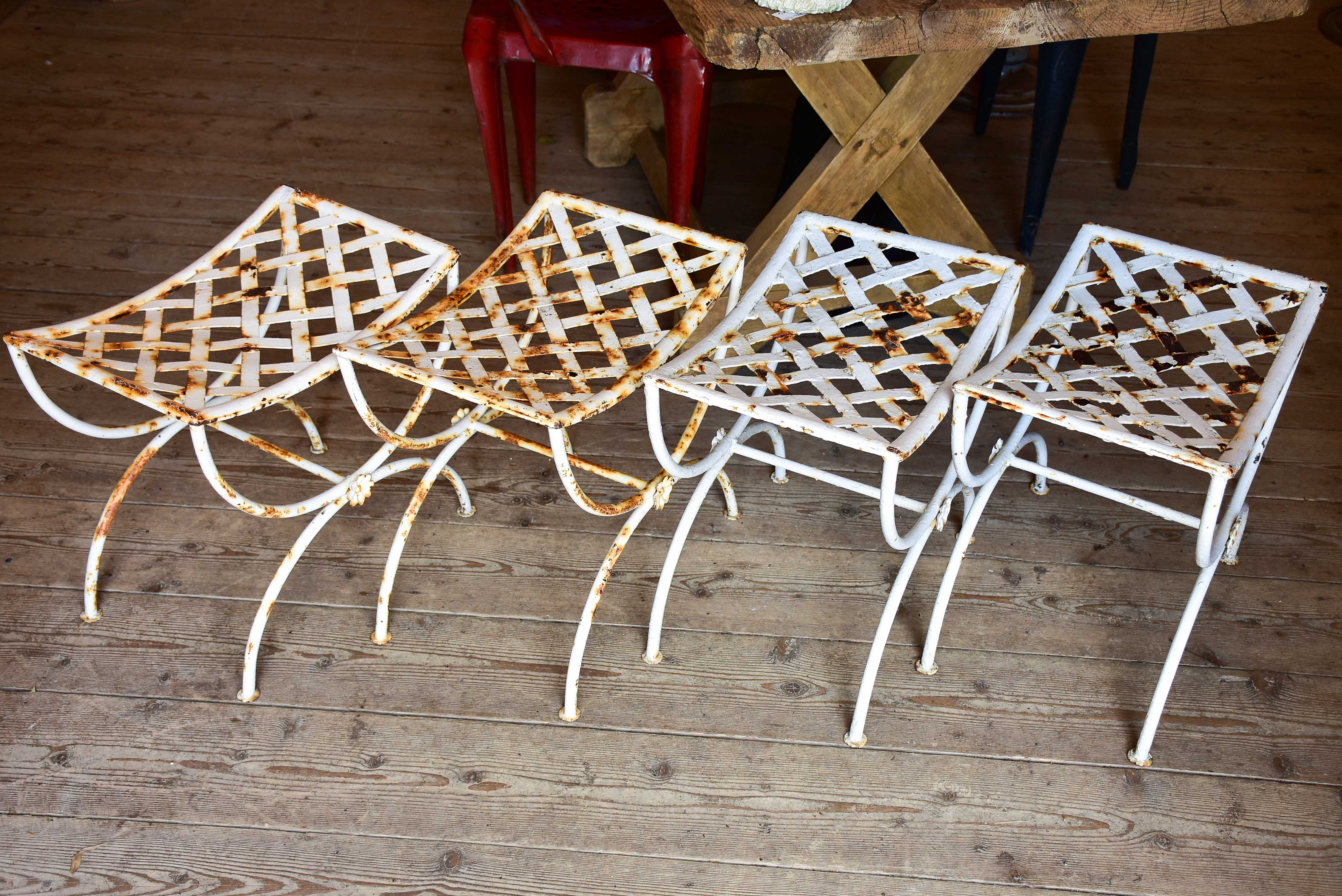 Four vintage French iron garden stools