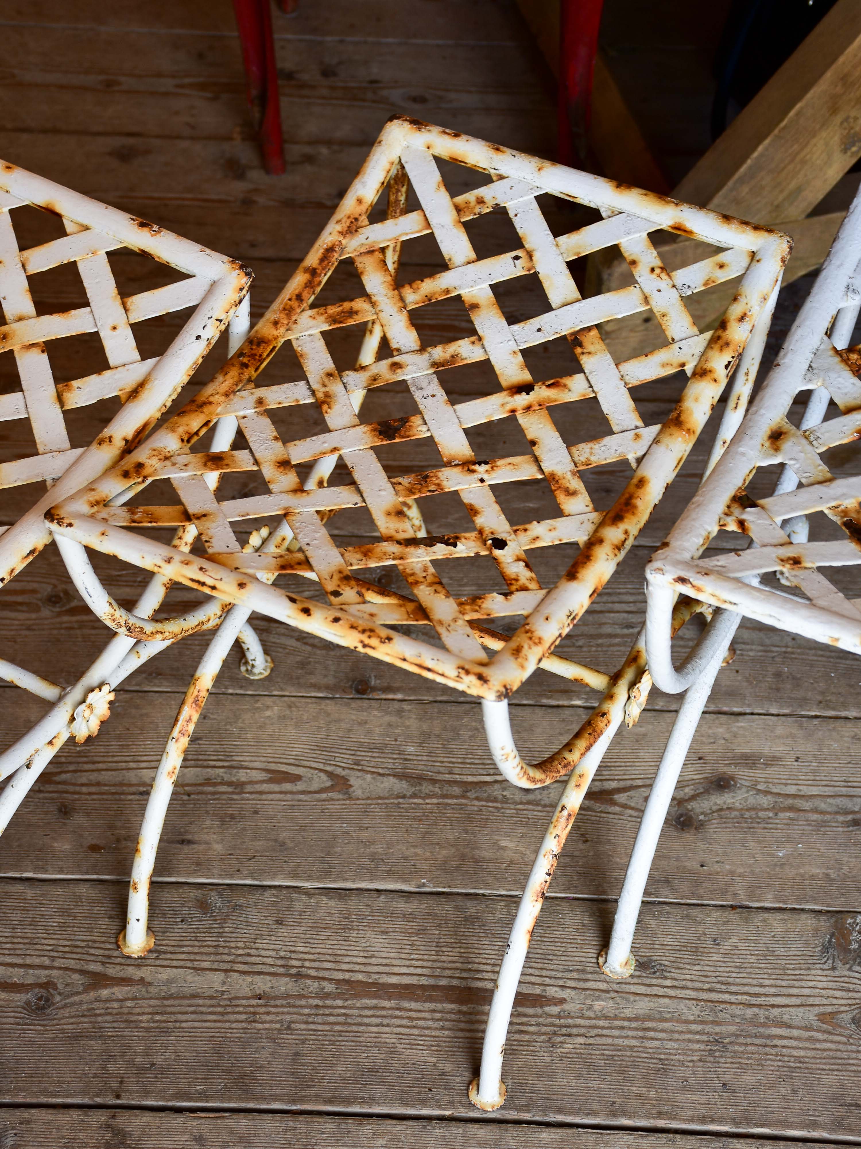 Four vintage French iron garden stools
