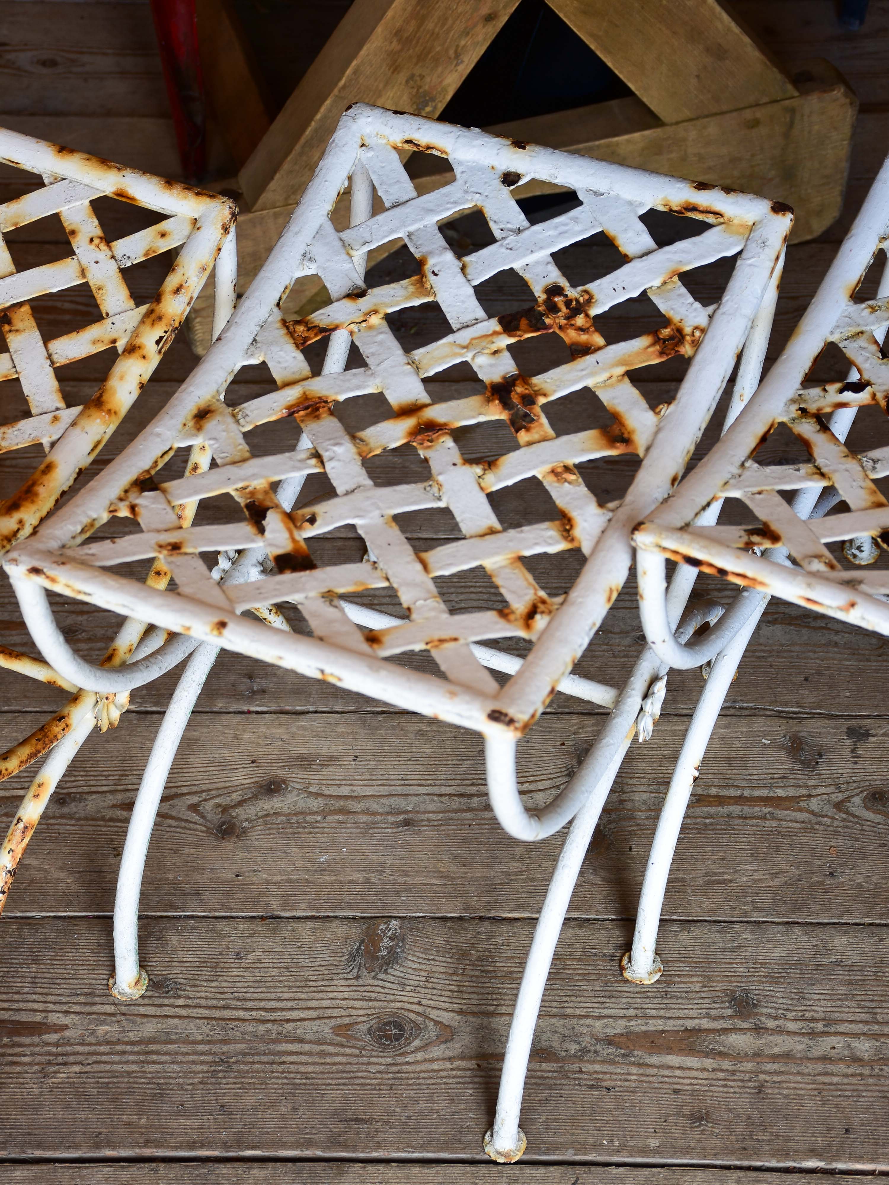 Four vintage French iron garden stools