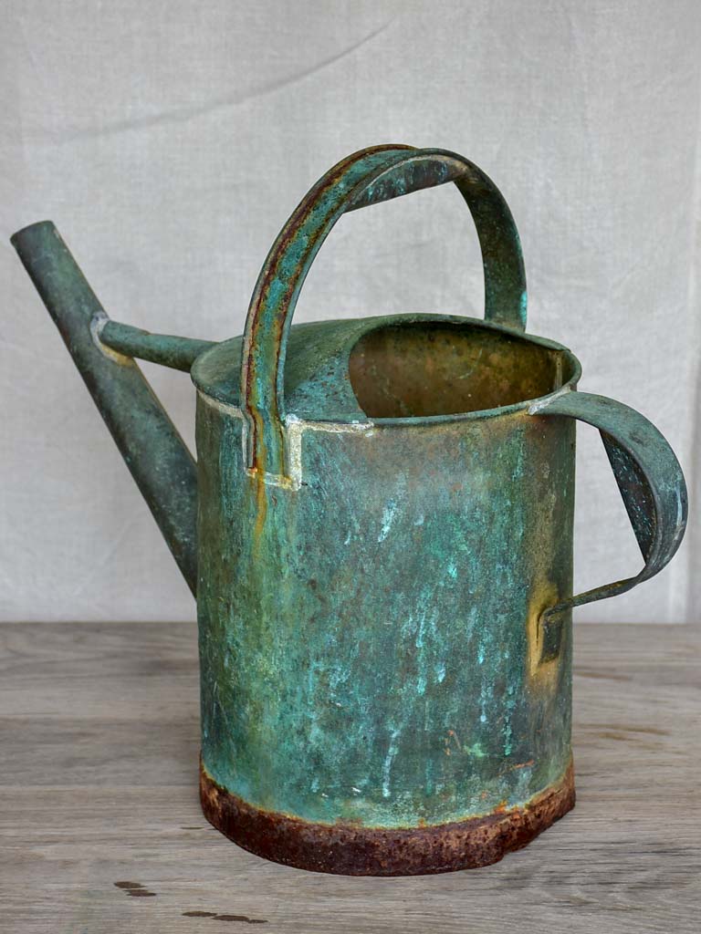 Antique French watering can with aqua patina