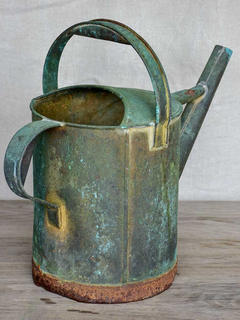 Antique French watering can with aqua patina