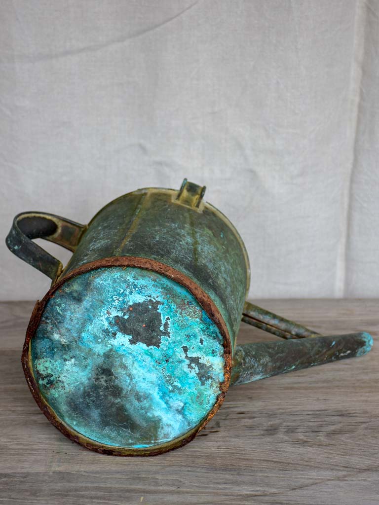 Antique French watering can with aqua patina