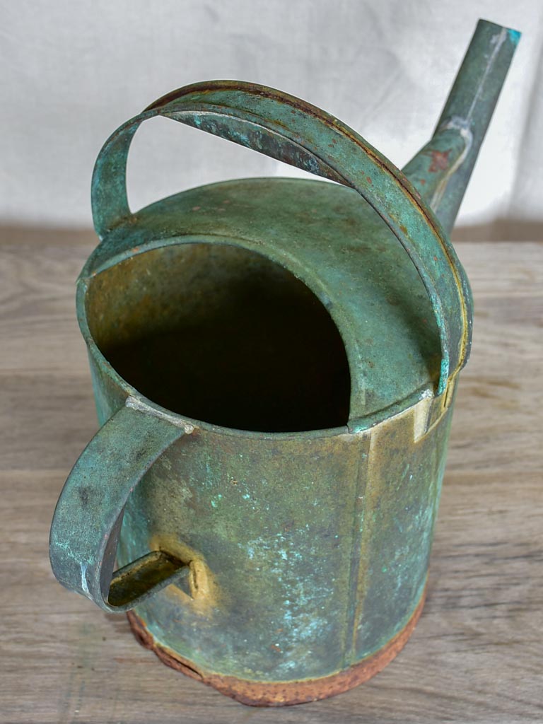 Antique French watering can with aqua patina