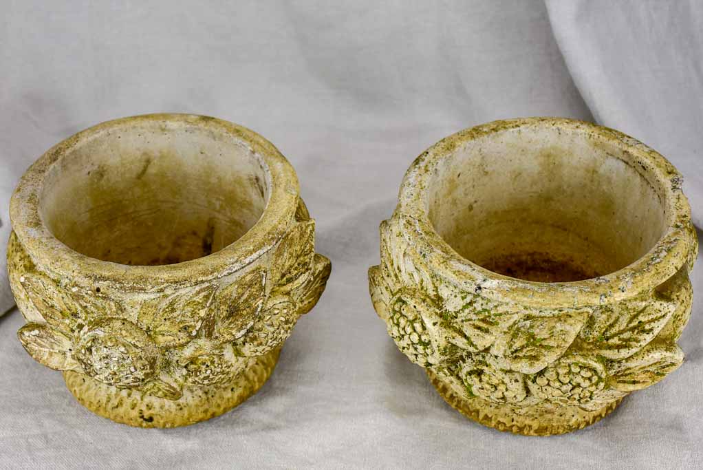 Pair of concrete flower pots decorated with pomegranates