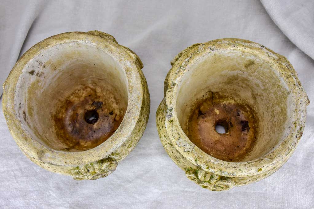 Pair of concrete flower pots decorated with pomegranates