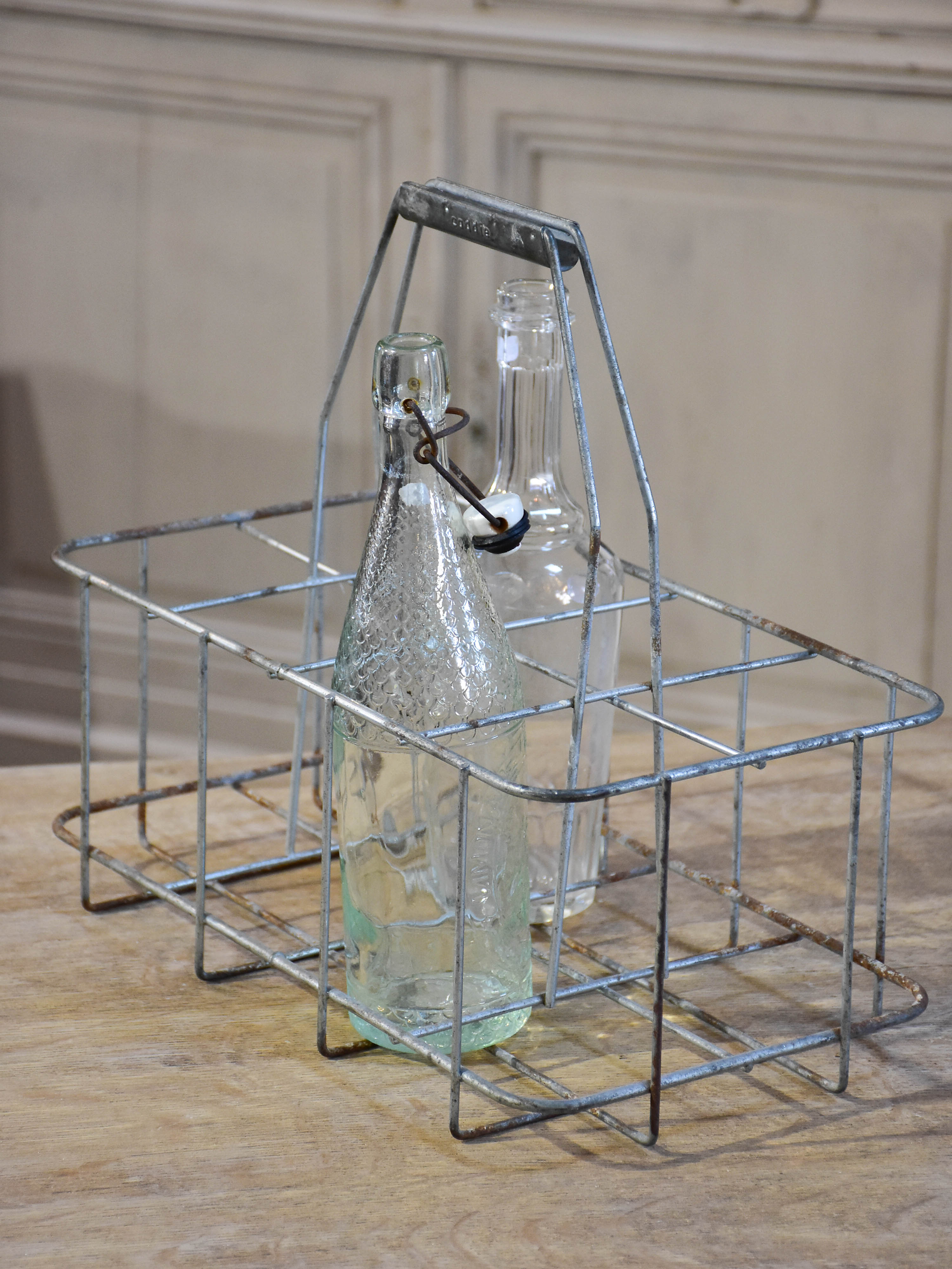 Collection of antique and vintage wire baskets and bottle carriers