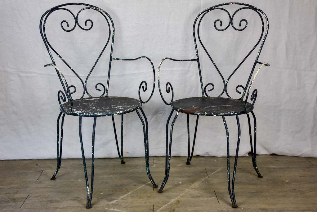 Pair of heart-back garden armchairs with black painted finish