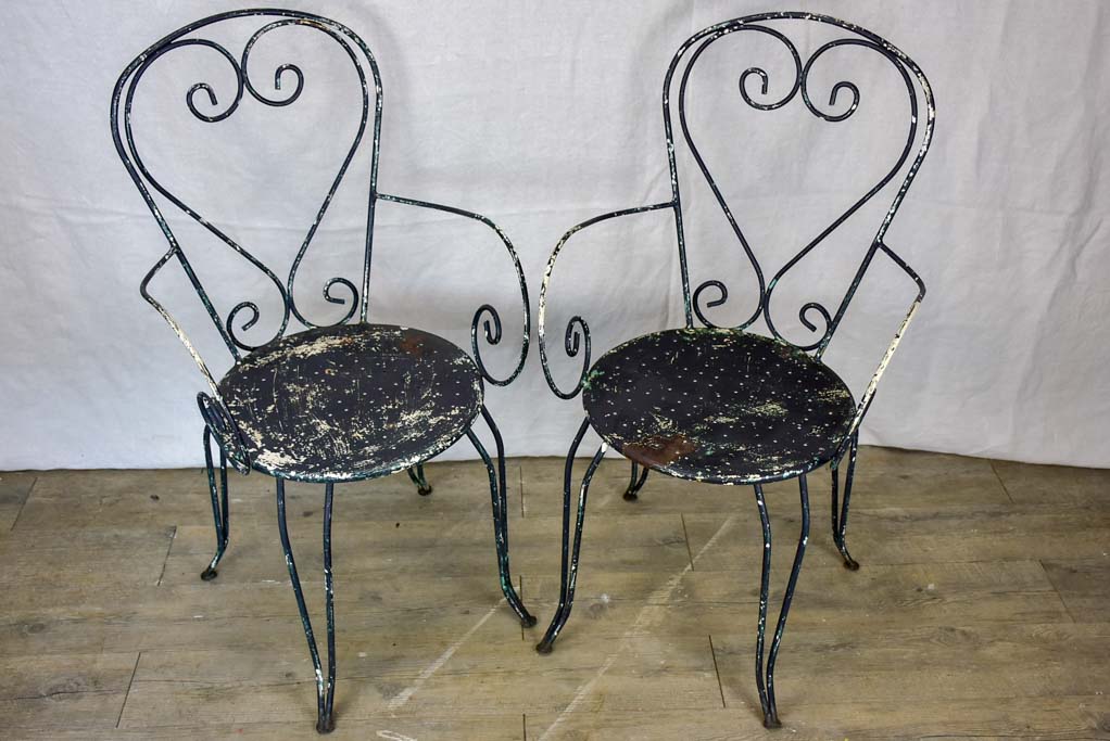 Pair of heart-back garden armchairs with black painted finish