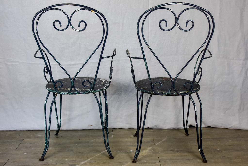 Pair of heart-back garden armchairs with black painted finish