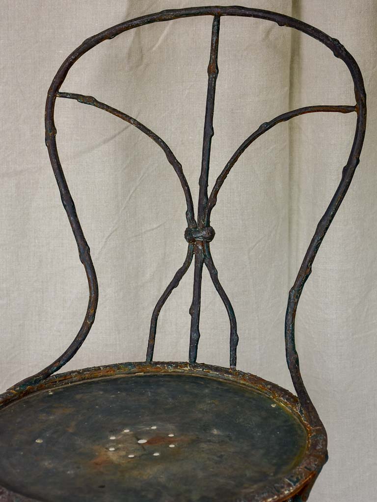 Antique French garden chair with branch - like back