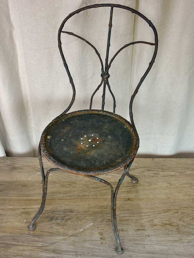 Antique French garden chair with branch - like back