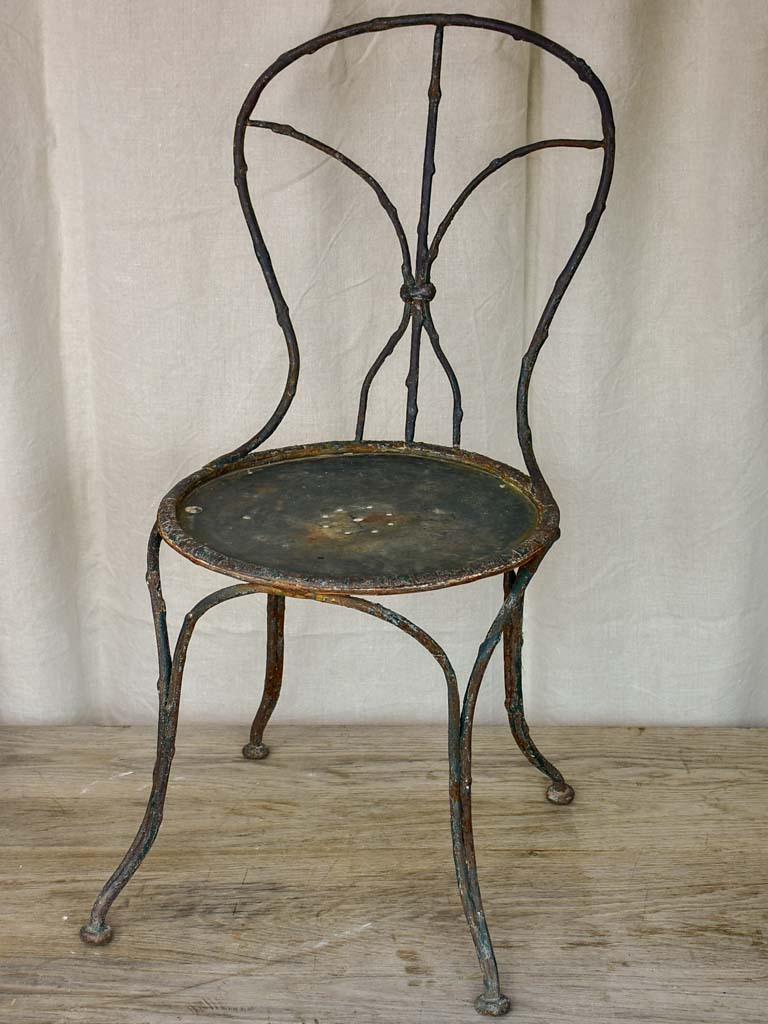 Antique French garden chair with branch - like back