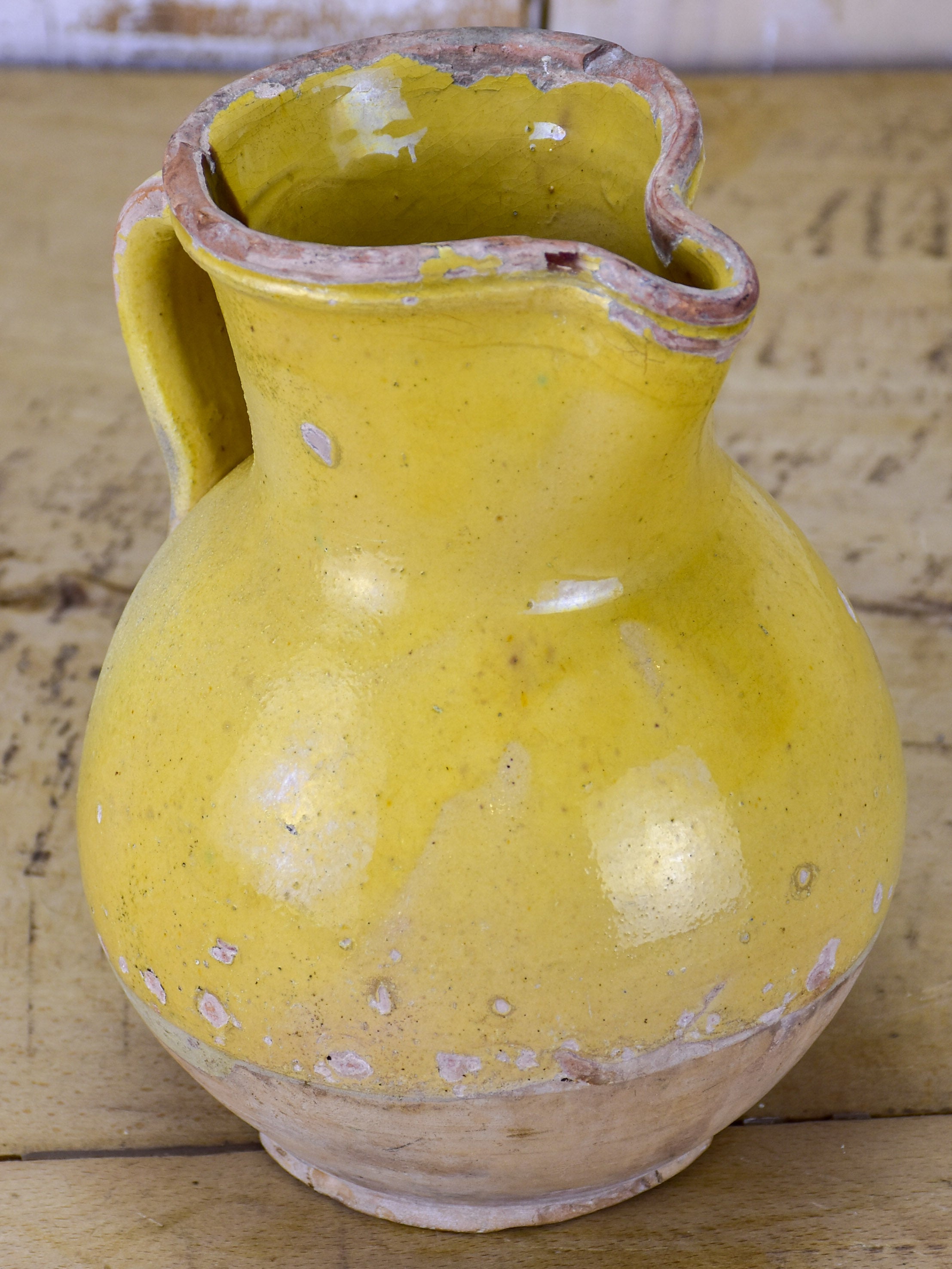 19th Century French pitcher with yellow glaze