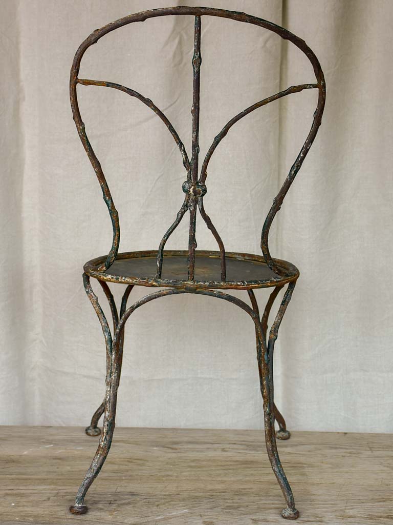 Antique French garden chair with branch - like back