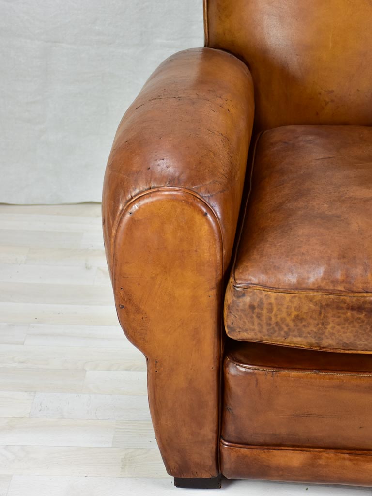 Large 1950's French leather club chair with mustache back and barrel arms