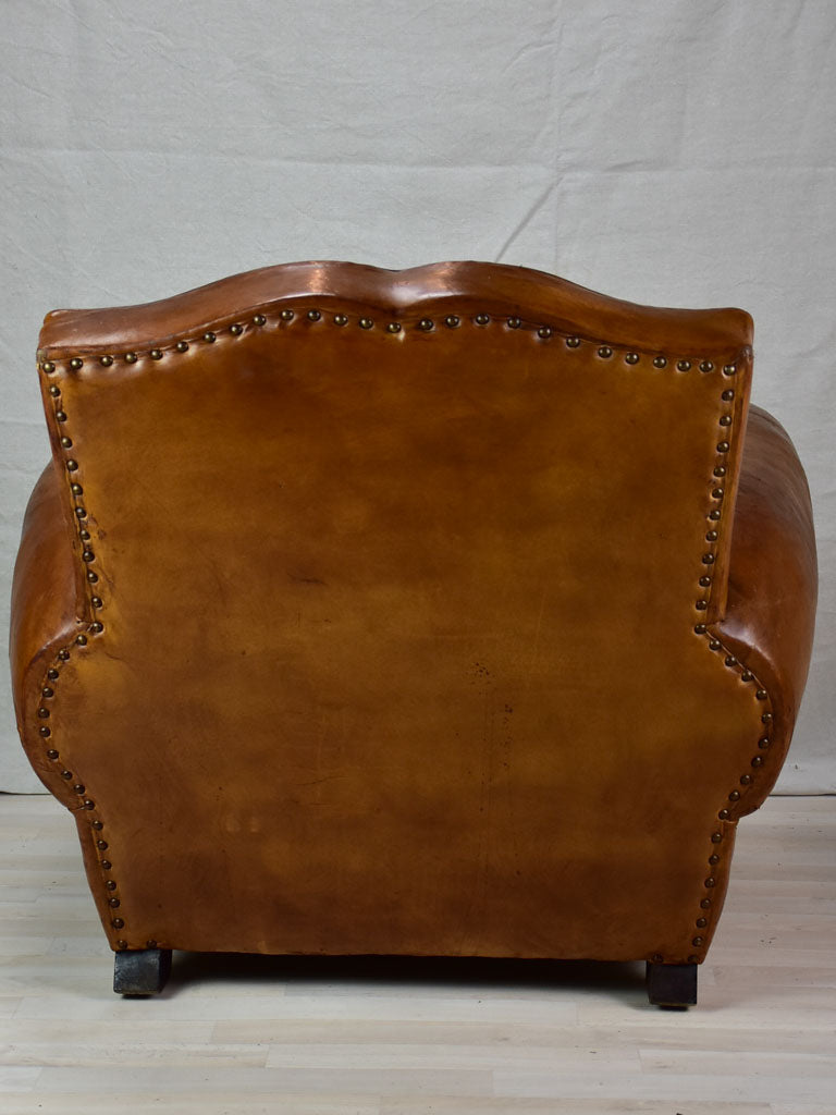 Large 1950's French leather club chair with mustache back and barrel arms
