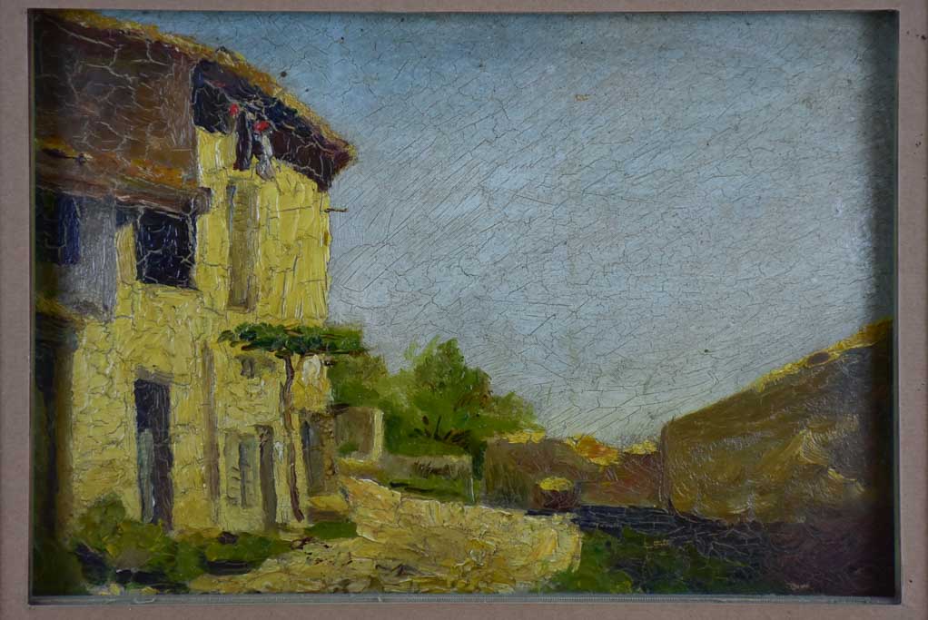Small antique French painting of a village 15 ¾" x 12 ½"