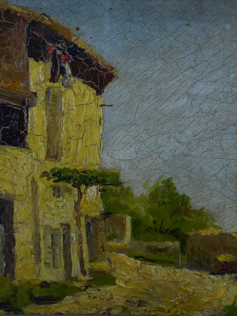 Small antique French painting of a village 15 ¾" x 12 ½"