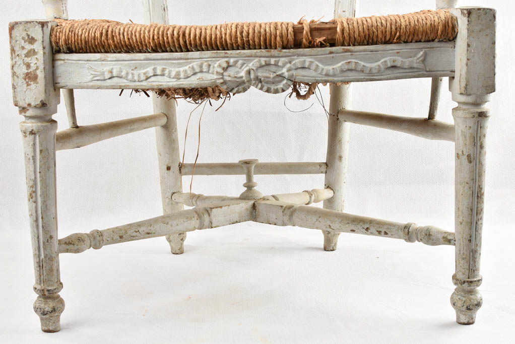 Beautiful worn-out Provence straw armchair