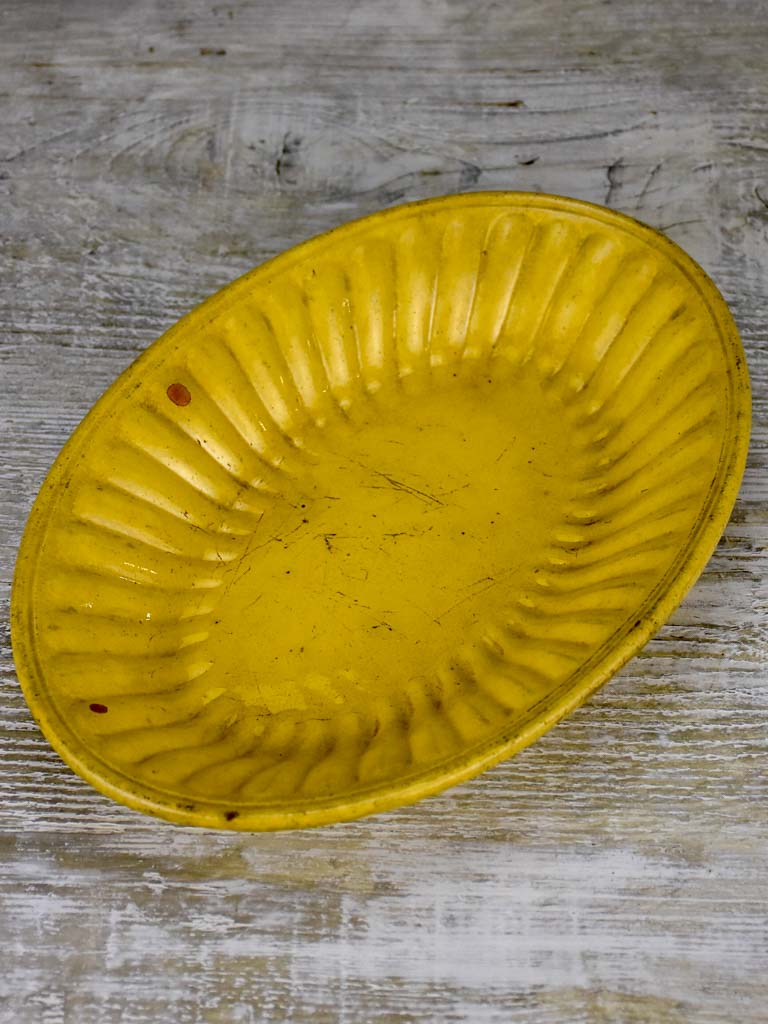 Yellow ware platter with rippled edge from south west France