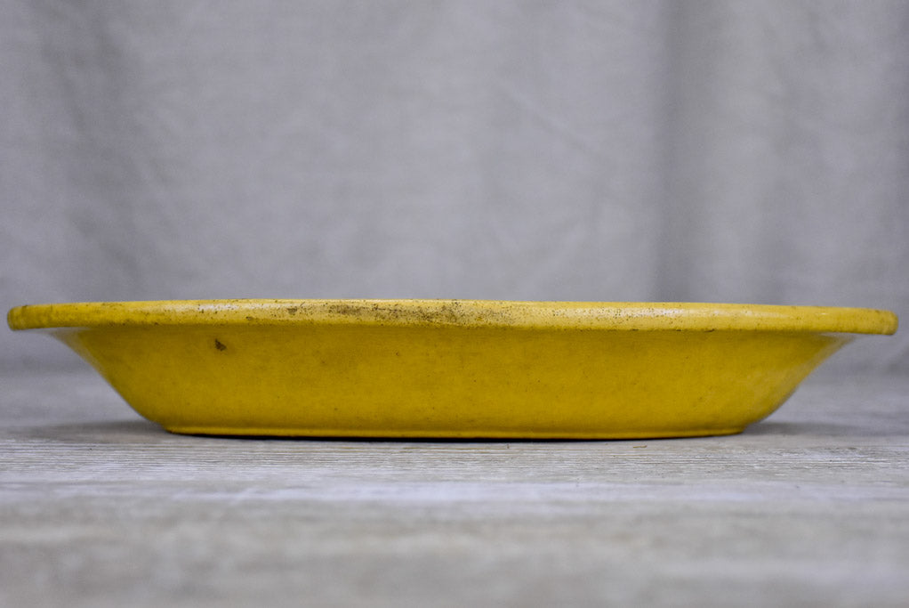 Yellow ware platter with rippled edge from south west France