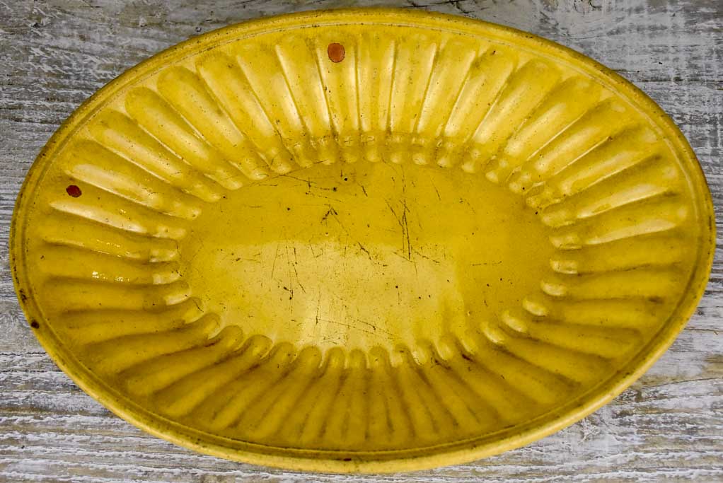 Yellow ware platter with rippled edge from south west France