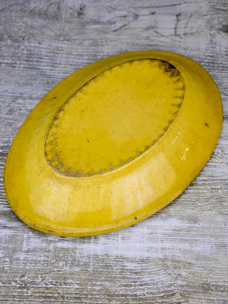 Yellow ware platter with rippled edge from south west France