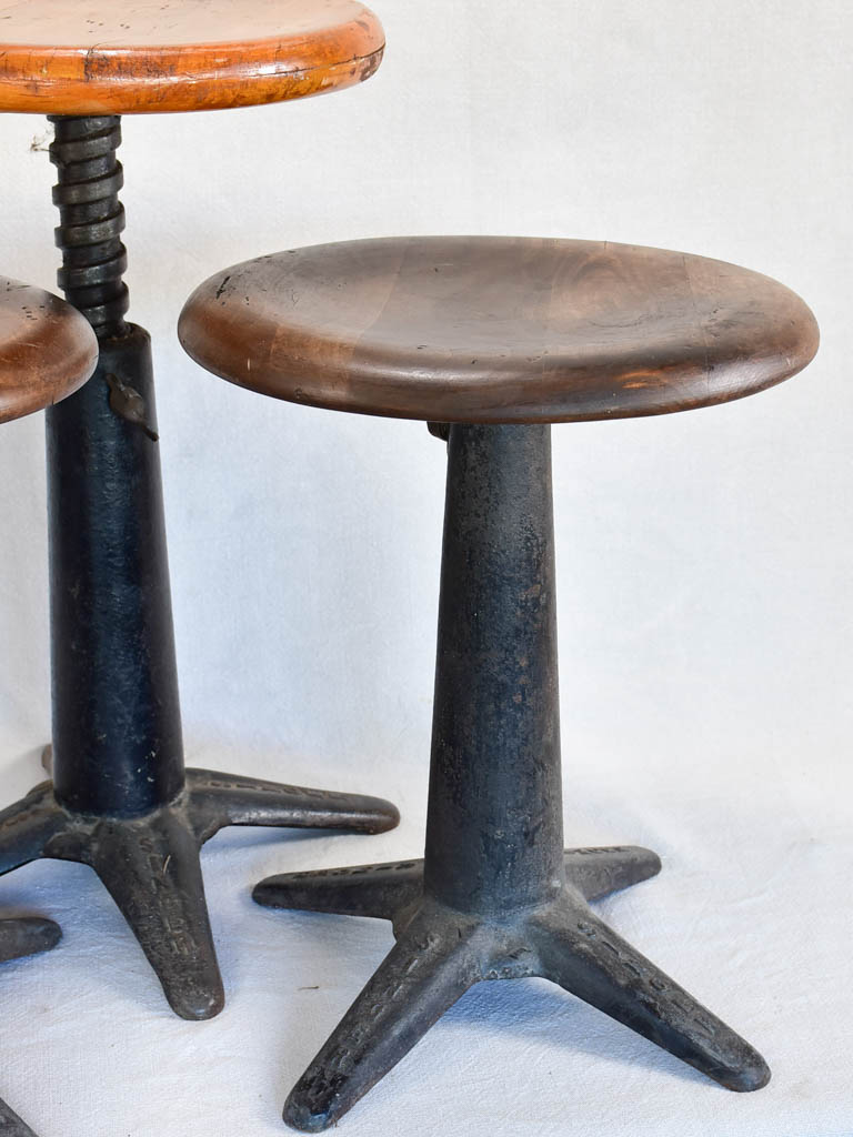 Collection of three sewing stools with cast iron bases "Singer"