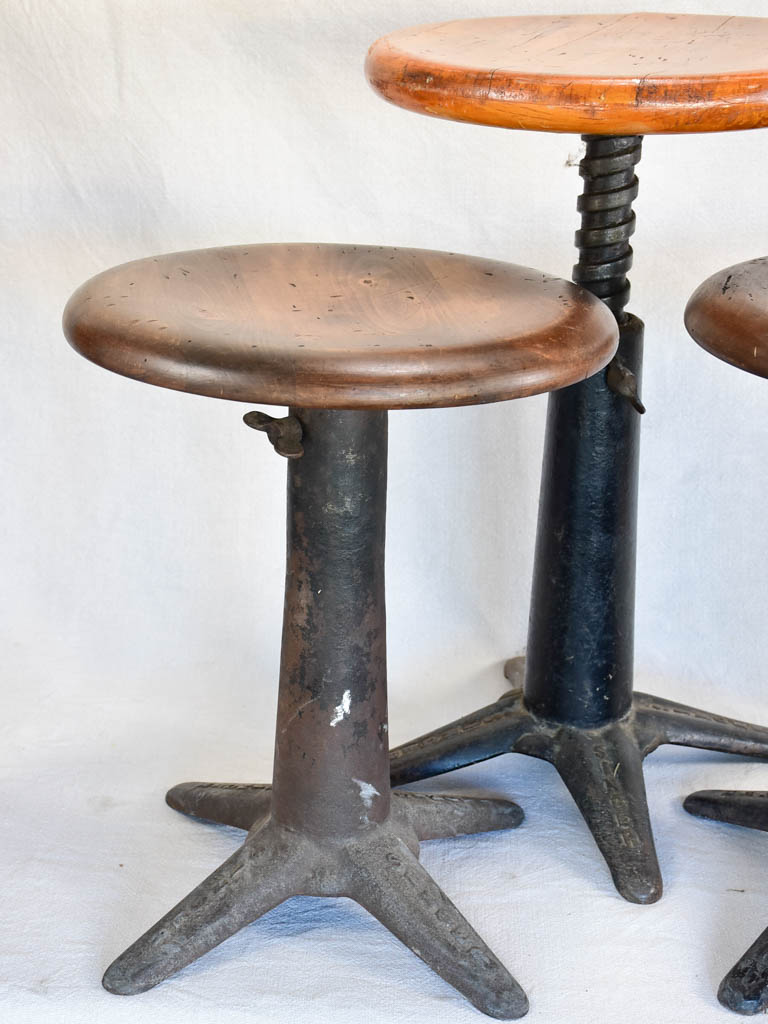 Collection of three sewing stools with cast iron bases "Singer"
