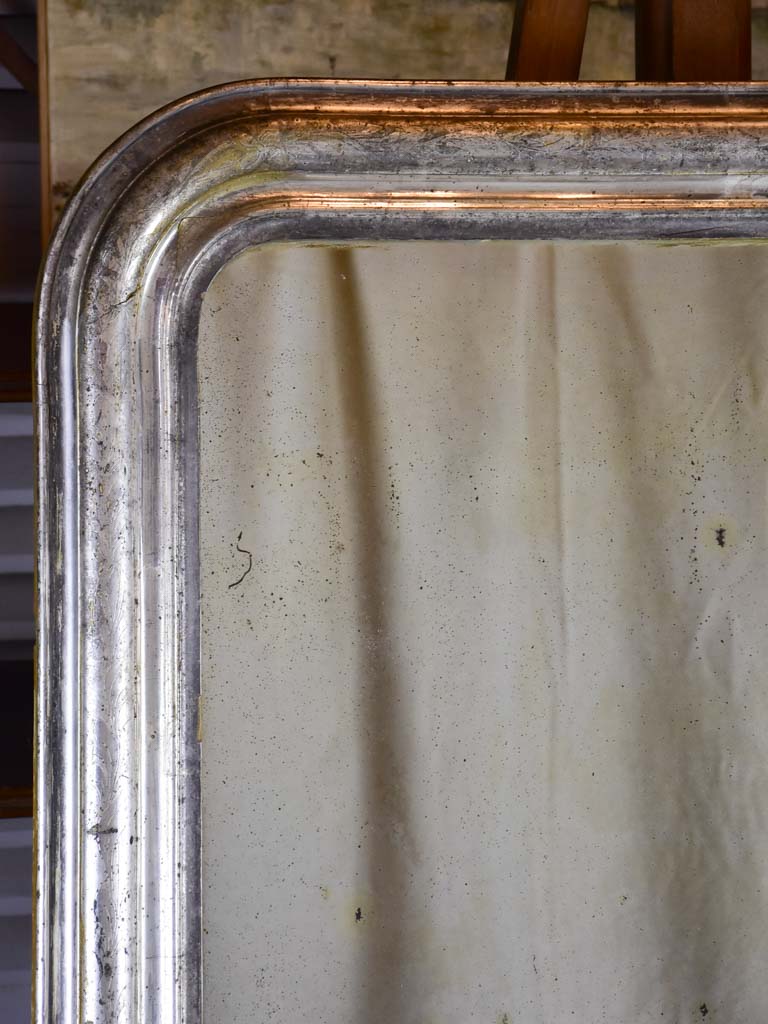 Broad Louis Philippe mirror with silver frame and original aged glass 31 ½" x 41 ¼"