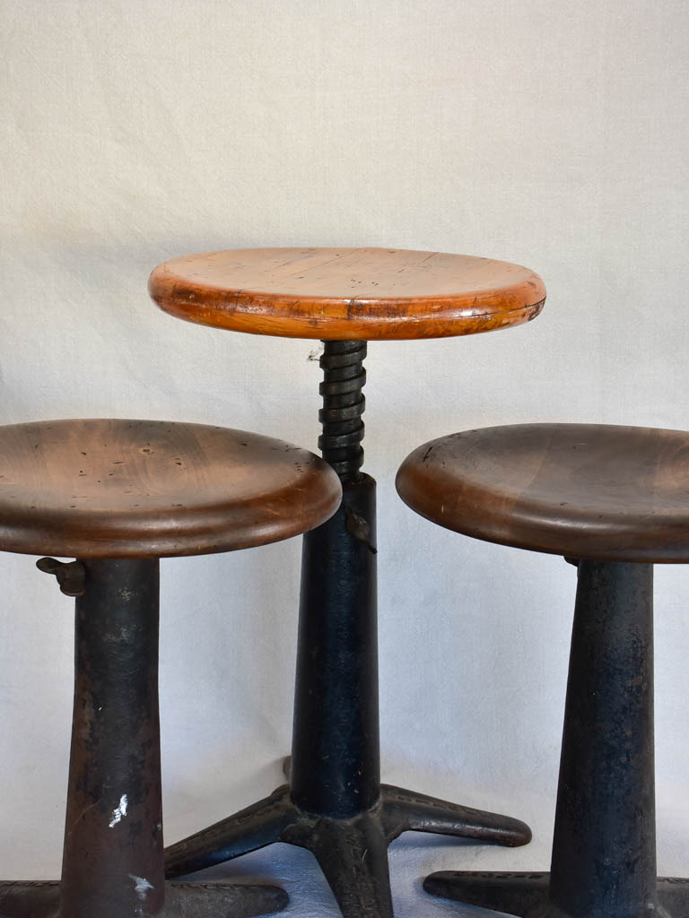 Collection of three sewing stools with cast iron bases "Singer"