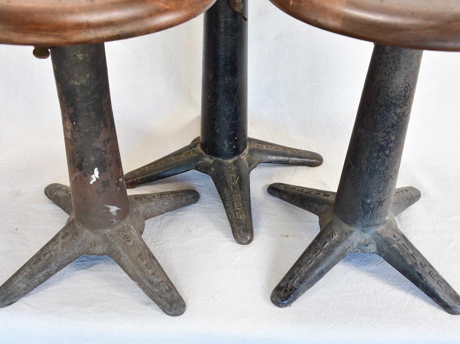Collection of three sewing stools with cast iron bases "Singer"