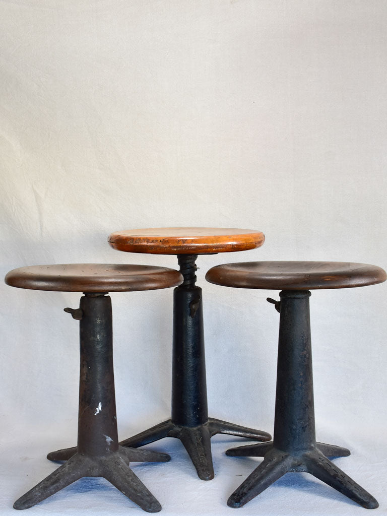 Collection of three sewing stools with cast iron bases "Singer"