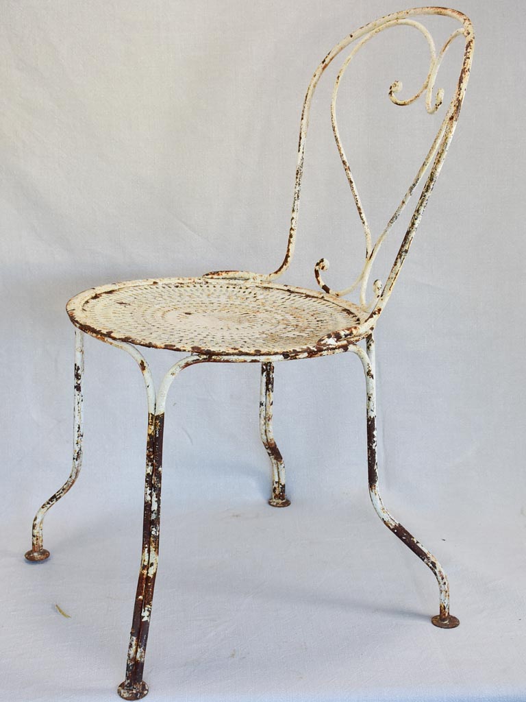 Pair of early twentieth century French garden chairs with white patina