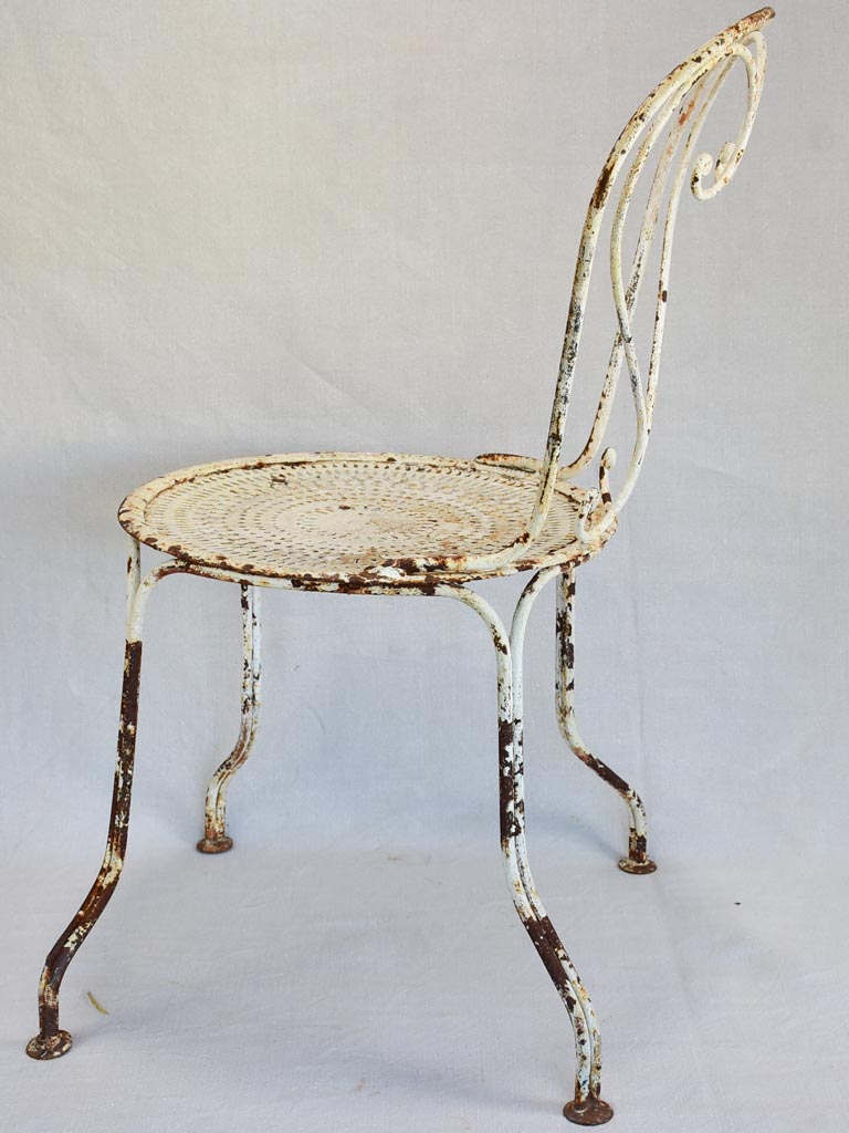 Pair of early twentieth century French garden chairs with white patina