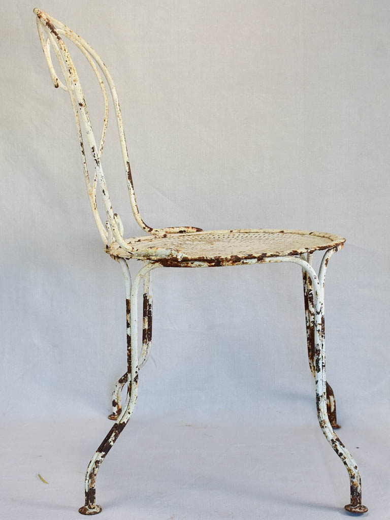 Pair of early twentieth century French garden chairs with white patina