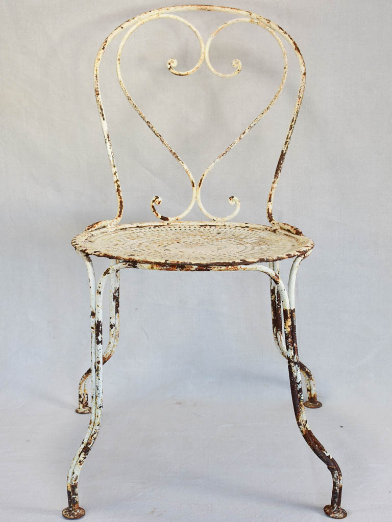 Pair of early twentieth century French garden chairs with white patina