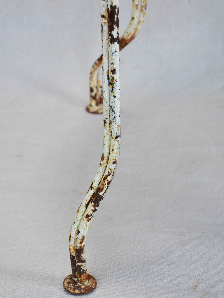 Pair of early twentieth century French garden chairs with white patina