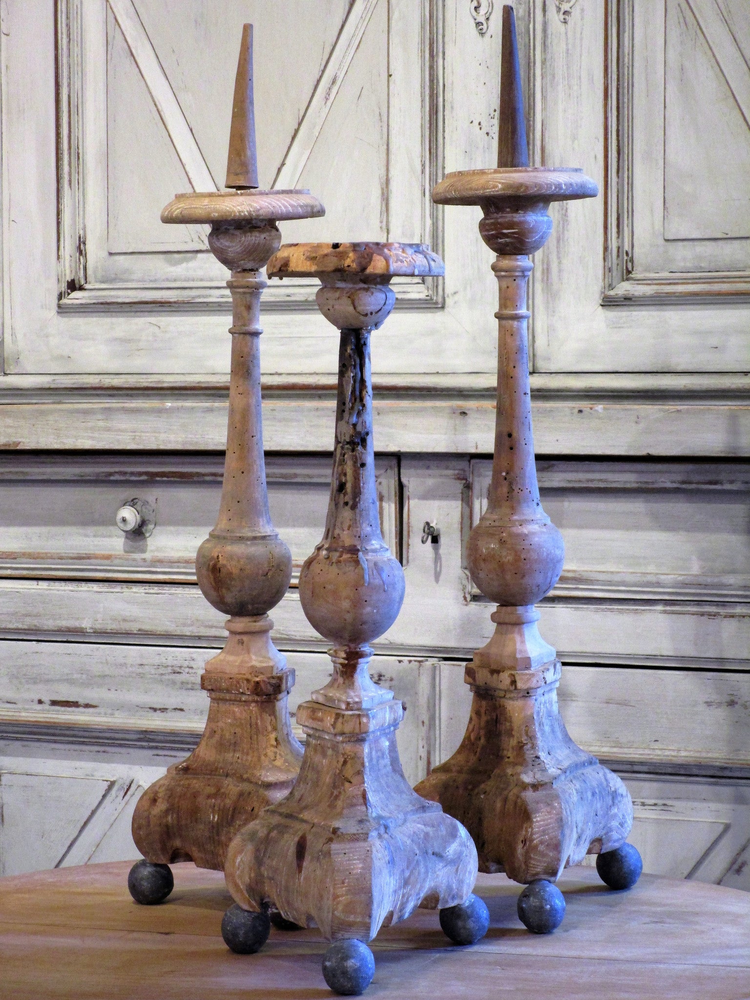 Set of three 19th century church candlesticks