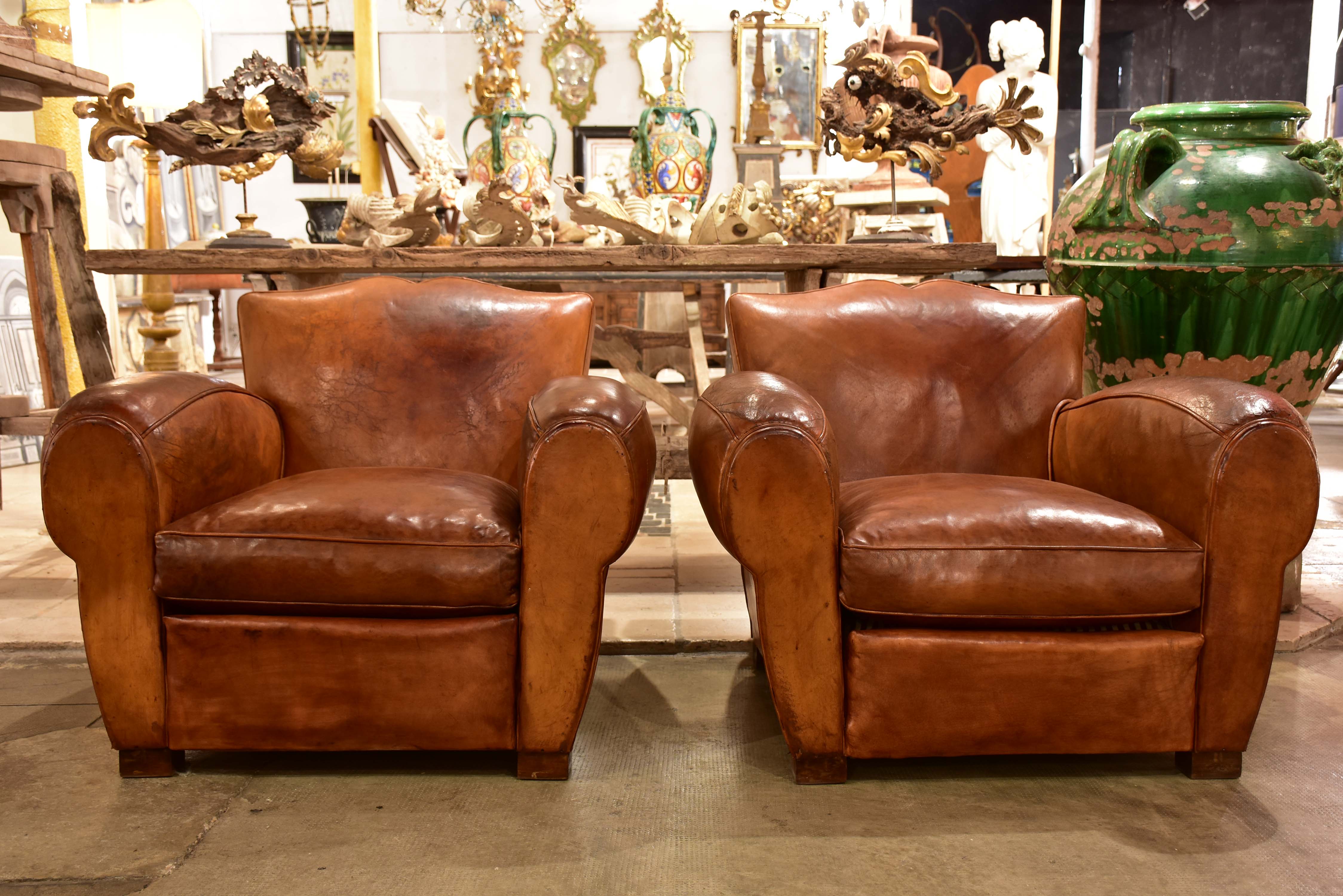 Pair of large vintage French club chairs with mustache back