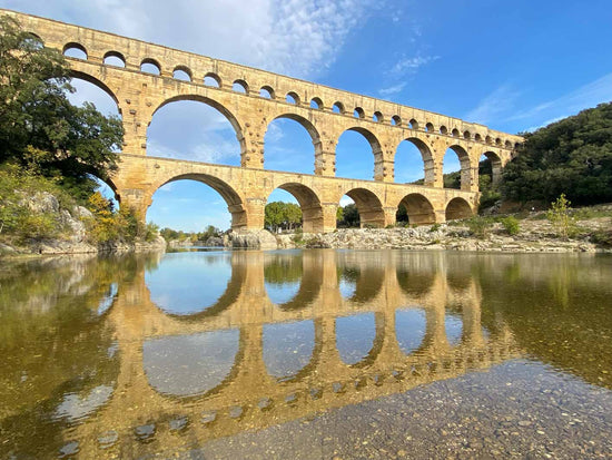 Cool off in the river under the majestic Pont du Gard